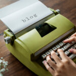 aerial-view-man-typing-retro-typewriter (1)